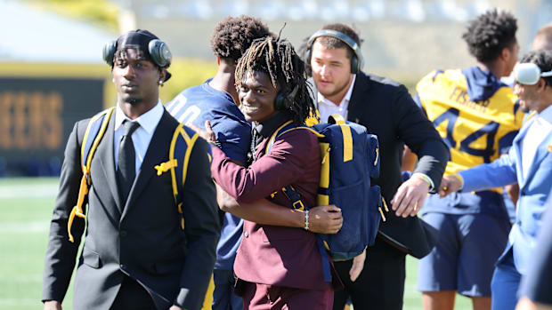 West Virginia University receiver DayDay Farmer (right) and West Virginia defensive back Jacoby Spells. 