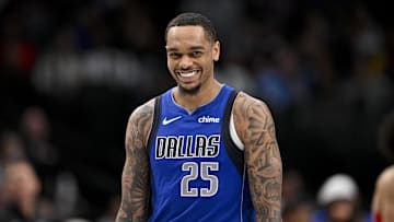Mar 21, 2025; Dallas, Texas, USA; Dallas Mavericks forward P.J. Washington (25) smiles for the fans during the second half of the game against the Detroit Pistons at the American Airlines Center. Mandatory Credit: Jerome Miron-Imagn Images