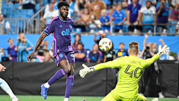 Charlotte FC forward Patrick Agyemang (33) scores as CF Montreal goalkeeper Jonathan Sirois (40) defends in the second half at Bank of America Stadium 