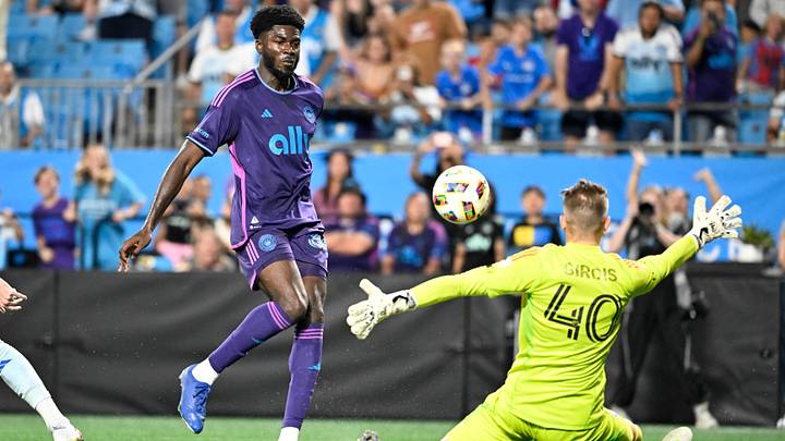 Charlotte FC forward Patrick Agyemang (33) scores as CF Montreal goalkeeper Jonathan Sirois (40) defends in the second half at Bank of America Stadium 