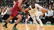 Oct 12, 2025; Boston, Massachusetts, USA; Boston Celtics guard/forward Jaylen Brown (7) drives to the basket against Cleveland Cavaliers guard/forward Jaylon Tyson (20) during the first half at TD Garden. Mandatory Credit: Brian Fluharty-Imagn Images