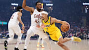 Indiana Pacers guard Andrew Nembhard (2) drives to the basket against Cleveland Cavaliers guard Donovan Mitchell (45) during the first quarter in game one of the second round for the 2025 NBA Playoffs at Rocket Arena.
