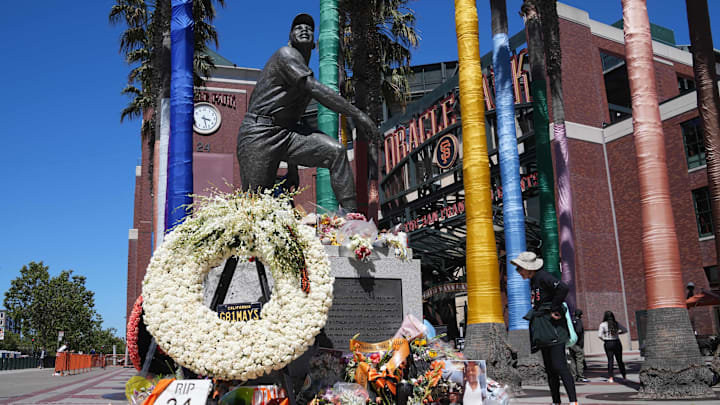 Jun 26, 2024; San Francisco, California, USA; Flowers are laid at the statue of San Francisco Giants former center fielder Willie Mays.