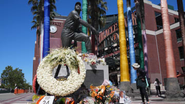 Jun 26, 2024; San Francisco, California, USA; Flowers are laid at the statue of San Francisco Giants former center fielder Willie Mays before the game against the Chicago Cubs at Oracle Park.