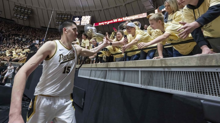 Purdue Boilermakers center Zach Edey high fives the student section 