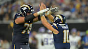 Oct 23, 2025; Inglewood, California, USA; Los Angeles Chargers quarterback Justin Herbert (10) reacts with offensive tackle Joe Alt (76) during the second half at SoFi Stadium. Mandatory Credit: Jayne Kamin-Oncea-Imagn Images
