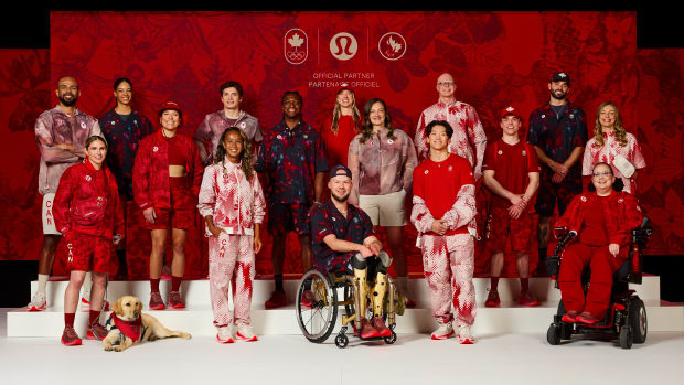 Team Canada athletes pose in gear for the 2024 Paris Olympics. 