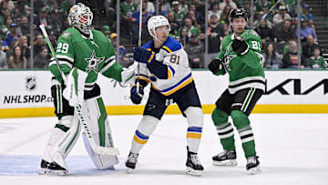 Mar 2, 2025; Dallas, Texas, USA; Dallas Stars goaltender Jake Oettinger (29) and defenseman Esa Lindell (23) and St. Louis Blues left wing Dylan Holloway (81) in action during the game between the Dallas Stars and the St. Louis Blues at the American Airlines Center. Mandatory Credit: Jerome Miron-Imagn Images