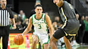 Oregon Ducks guard Jackson Shelstad (3) dribbles the ball against Purdue Boilermakers guard Myles Colvin (5) during the first half at Matthew Knight Arena.