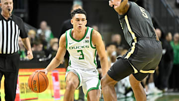 Oregon Ducks guard Jackson Shelstad (3) dribbles the ball against Purdue Boilermakers guard Myles Colvin (5) during the first half at Matthew Knight Arena.