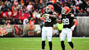 Nov 30, 2025; Cleveland, Ohio, USA;  Cleveland Browns defensive end Myles Garrett (95) and Cleveland Browns defensive end Cameron Thomas (99) celebrate after a play during the second half against the San Francisco 49ers at Huntington Bank Field. Mandatory Credit: Ken Blaze-Imagn Images