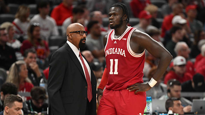 Indiana Hoosiers head coach Mike Woodson talks with Indiana Hoosiers center Oumar Ballo (11) during the second half against the Oregon Ducks at Gainbridge Fieldhouse. Indiana Hoosiers head coach Mike Woodson talks with Indiana Hoosiers center Oumar Ballo (11) during the second half against the Oregon Ducks at Gainbridge Fieldhouse.
