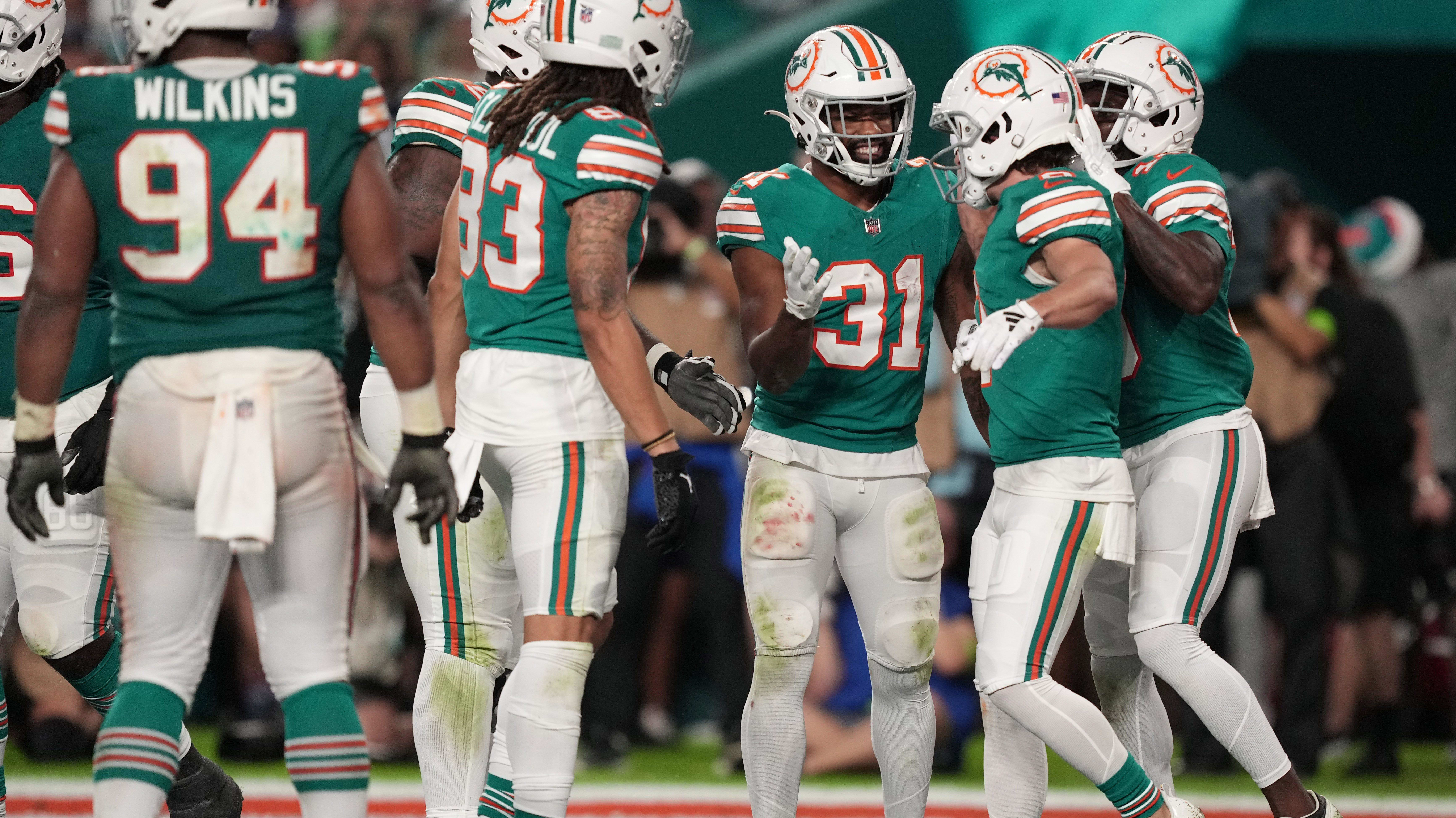 Raheem Mostert celebrates a touchdown.