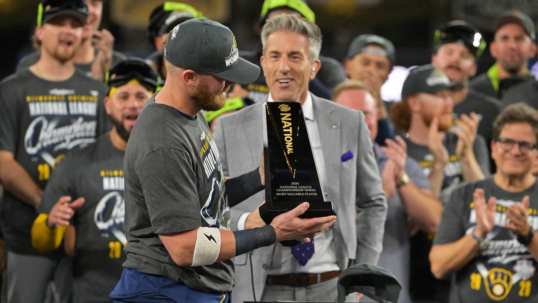 Oct 15, 2026; Los Angeles, California, USA;  Milwaukee Brewers first baseman Jake Bauers (9) receives the MVP trophy after defeating the Los Angeles Dodgers in game four of the NLCS for the 2026 MLB Playoffs at Uniqlo Field at Dodger Stadium.  Mandatory Credit: Jayne Kamin-Oncea-Imagn Images