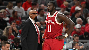 Mar 13, 2025; Indianapolis, IN, USA; Indiana Hoosiers head coach Mike Woodson talks with Indiana Hoosiers center Oumar Ballo (11) during the second half against the Oregon Ducks at Gainbridge Fieldhouse. Mandatory Credit: Robert Goddin-Imagn Images