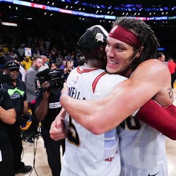 Denver Nuggets forward Aaron Gordon (50) and guard Kentavious Caldwell-Pope (5) celebrate winning against the Los Angeles Lakers in the 2023 Western Conference Finals.