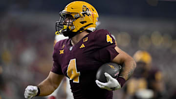 Dec 7, 2024; Arlington, TX, USA; Arizona State Sun Devils running back Cam Skattebo (4) scores a rushing touchdown against the Iowa State Cyclones during the second half at AT&T Stadium. 