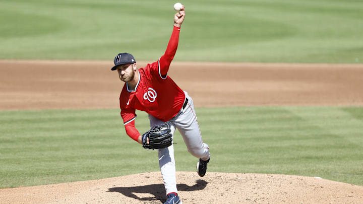 Feb 25, 2025; Jupiter, Florida, USA; Washington Nationals relief pitcher Colin Poche (41) throws against the Miami Marlins during the fourth inning at Roger Dean Chevrolet Stadium. Mandatory Credit: Rhona Wise-Imagn Image 