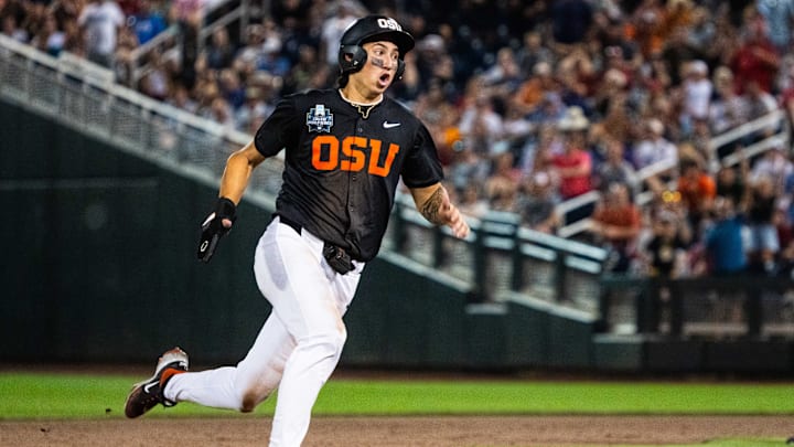 Jun 13, 2025; Omaha, Neb, USA; Oregon State Beavers shortstop Aiva Arquette (13) heads to third on a walk off RBI double against the Louisville Cardinals during the ninth inning at Charles Schwab Field. Mandatory Credit: Dylan Widger-Imagn Images