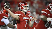 Nov 8, 2025; Louisville, Kentucky, USA;  Louisville Cardinals quarterback Miller Moss (7) looks to pass against the California Golden Bears during the first half at L&N Federal Credit Union Stadium. Mandatory Credit: Jamie Rhodes-Imagn Images