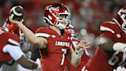 Nov 8, 2025; Louisville, Kentucky, USA;  Louisville Cardinals quarterback Miller Moss (7) looks to pass against the California Golden Bears during the first half at L&N Federal Credit Union Stadium. Mandatory Credit: Jamie Rhodes-Imagn Images
