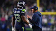 Oct 20, 2025; Seattle, Washington, USA; Seattle Seahawks linebacker Ernest Jones IV (13) talks with Seattle Seahawks head coach Mike Macdonald during the fourth quarter against the Houston Texans at Lumen Field.