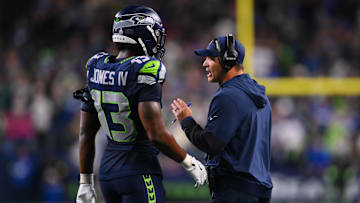 Oct 20, 2025; Seattle, Washington, USA; Seattle Seahawks linebacker Ernest Jones IV (13) talks with Seattle Seahawks head coach Mike Macdonald during the fourth quarter against the Houston Texans at Lumen Field.