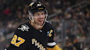 Mar 11, 2025; Pittsburgh, Pennsylvania, USA;  Pittsburgh Penguins center Sidney Crosby (87) smiles on the ice against the Vegas Golden Knights during the third period at PPG Paints Arena. Mandatory Credit: Charles LeClaire-Imagn Images