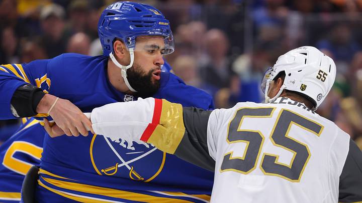 Mar 15, 2025; Buffalo, New York, USA;  Buffalo Sabres left wing Jordan Greenway (12) and Vegas Golden Knights right wing Keegan Kolesar (55) fight during the second period at KeyBank Center. Mandatory Credit: Timothy T. Ludwig-Imagn Images