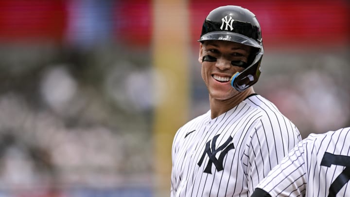 Yankees center fielder Aaron Judge smiles after drawing a walk during a game in 2023.