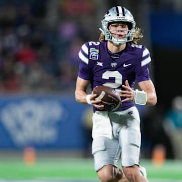 Dec 28, 2023; Orlando, FL, USA; Kansas State quarterback Avery Johnson (2) runs the ball against NC State in the second quarter at Camping World Stadium. Mandatory Credit: Jeremy Reper-Imagn Images