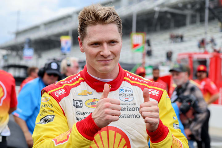 Team Penske driver Josef Newgarden gives a thumbs up after winning the Pit Stop Challenge ahead of the Indianapolis 500.