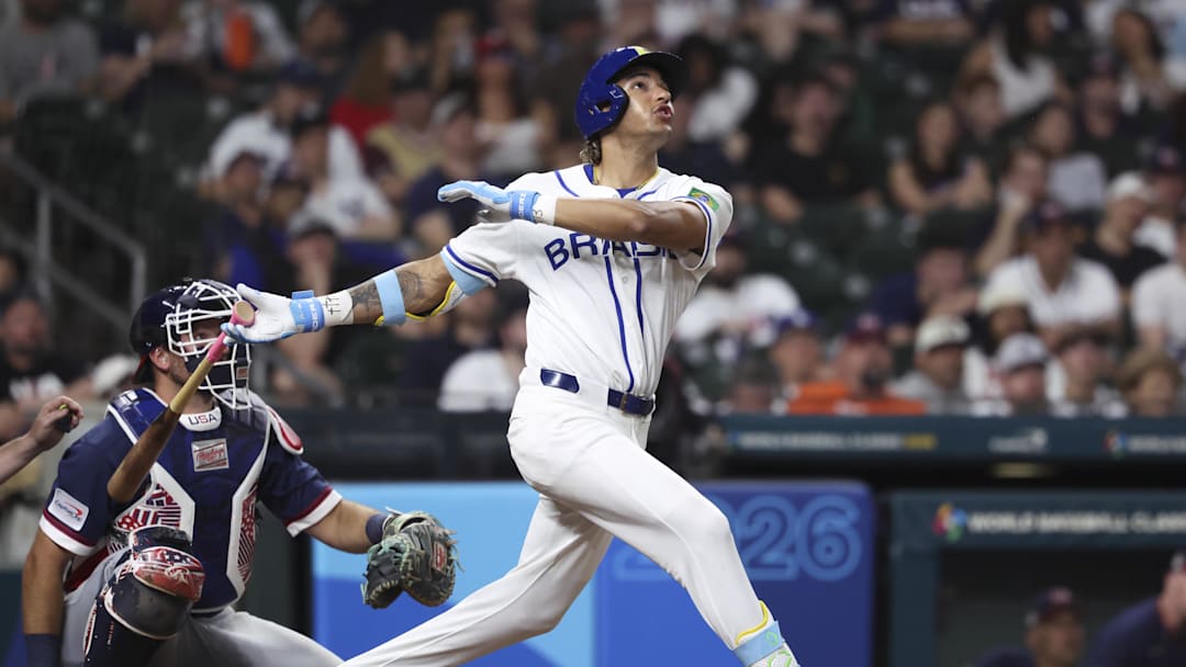 Mar 6, 2026; Houston, TX, United States; Brazil outfielder Lucas Ramirez (24) hits a home run during the eighth inning against the United States at Daikin Park. Mandatory Credit: Troy Taormina-Imagn Images