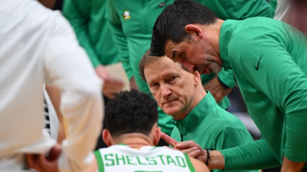 Oregon coach Dana Altman talks to his players during Sunday's NCAA Tournament loss to Arizona in Seattle, Wash.