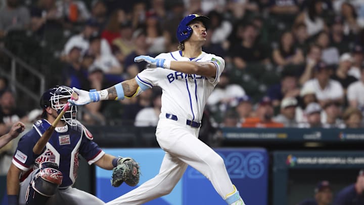 Mar 6, 2026; Houston, TX, United States; Brazil outfielder Lucas Ramirez (24) hits a home run during the eighth inning against the United States at Daikin Park. Mandatory Credit: Troy Taormina-Imagn Images