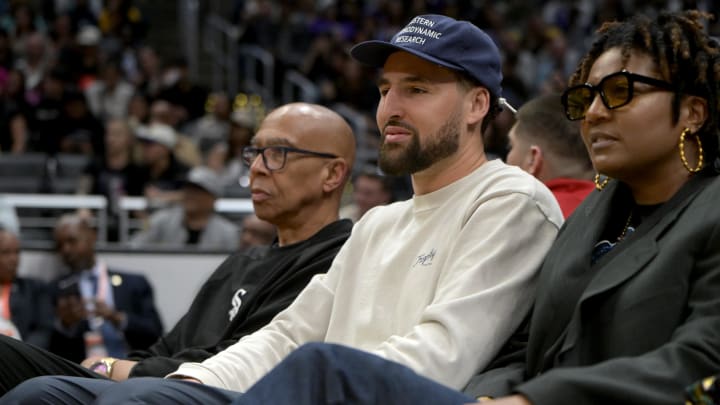 Former NBA player Mychal Thompson and his son Golden State Warriors Klay Thompson attend the game between the Los Angeles Spa