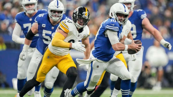 Indianapolis Colts quarterback Gardner Minshew II (10) scrambles with the ball as Pittsburgh Steelers linebacker T.J. Watt (90) gives chase Saturday, Dec. 16, 2023, during a game against the Pittsburgh Steelers at Lucas Oil Stadium in Indianapolis.