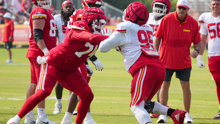 Jul 26, 2024; Kansas City, MO, USA; Kansas City Chiefs offensive tackle Jawaan Taylor (74) and defensive tackle Chris Jones (95) run drills during training camp at Missouri Western State University. Mandatory Credit: Denny Medley-Imagn Images
