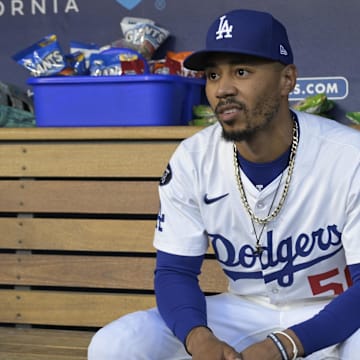 Jul 22, 2025; Los Angeles, California, USA;  Los Angeles Dodgers shortstop Mookie Betts (50) in the dugout prior to the first inning of the game against the Minnesota Twins at Dodger Stadium. Mandatory Credit: Jayne Kamin-Oncea-Imagn Images