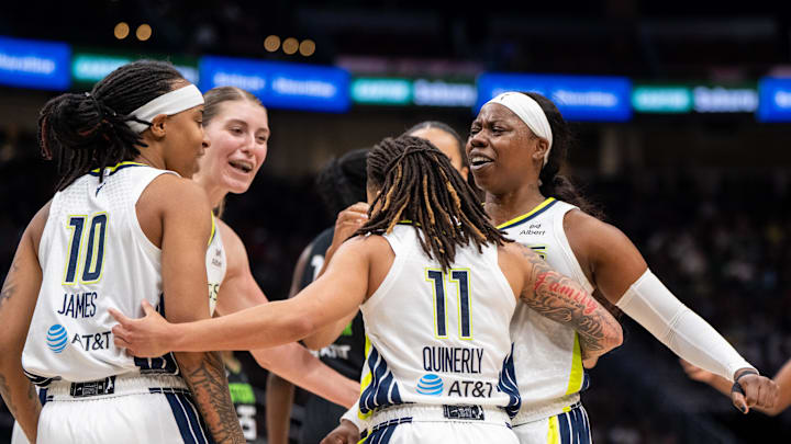 Aziaha James (10), center Luisa Geiselsoder (18) guard JJ Quinerly (11) and guard Arike Ogunbowale (24) celebrate during the second half against the Seattle Storm.