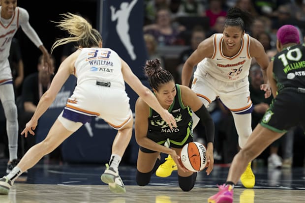 Minnesota Lynx forward Napheesa Collier falls to the ground.