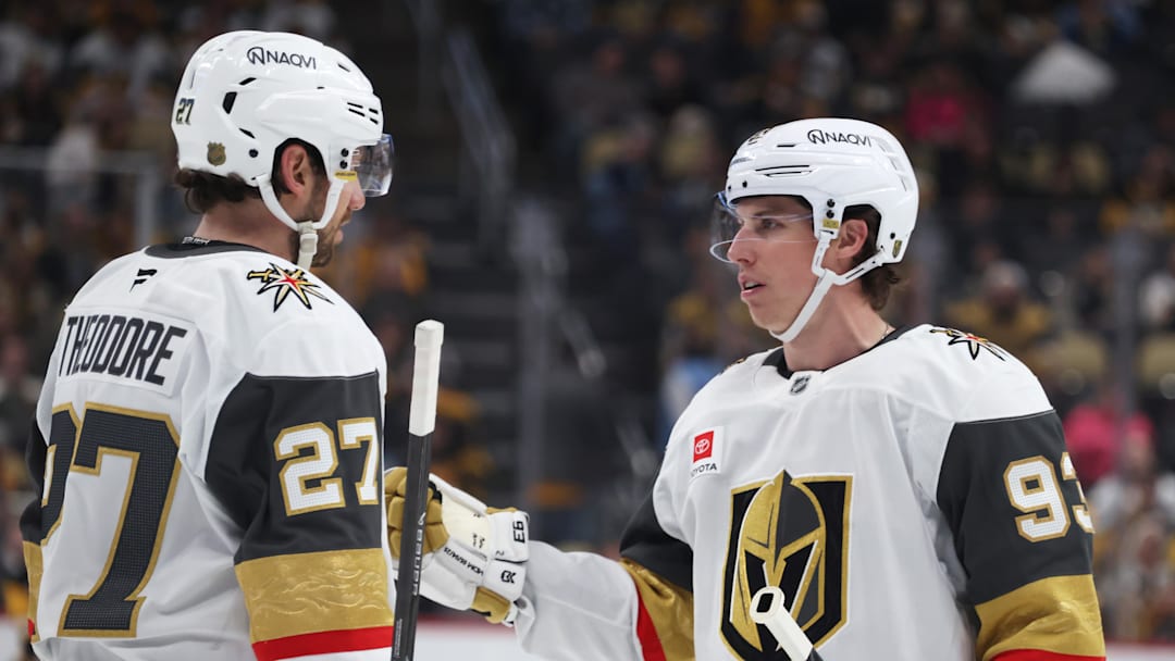 Mar 1, 2026; Pittsburgh, Pennsylvania, USA;  Vegas Golden Knights defenseman Shea Theodore (27) and right wing Mitch Marner (93) talk on the ice against the Pittsburgh Penguins during the third period at PPG Paints Arena. Mandatory Credit: Charles LeClaire-Imagn Images