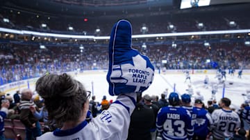 Feb 8, 2025; Vancouver, British Columbia, CAN; A Toronto Maple Leafs fan cheers on the team during warm up prior to a game against the Vancouver Canucks at Rogers Arena. Mandatory Credit: Bob Frid-Imagn Images