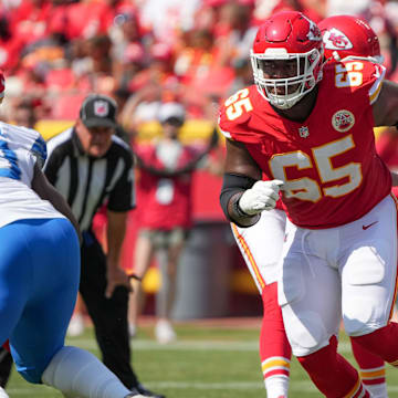 Aug 17, 2024; Kansas City, Missouri, USA; Kansas City Chiefs guard Trey Smith (65) prepares to block against the Detroit Lions during the game at GEHA Field at Arrowhead Stadium. Mandatory Credit: Denny Medley-Imagn Images