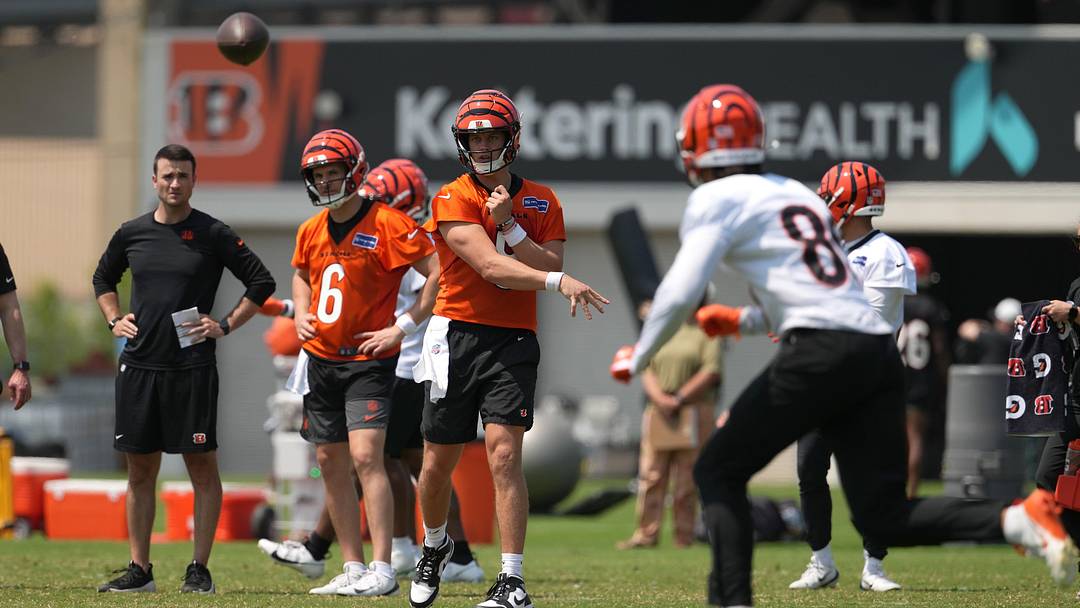Jun 10, 2025; Cincinnati, OH, USA; Cincinnati Bengals quarterback Joe Burrow (9) throws to wide receiver Andrei Iosivas (80) during practice at Paycor Stadium. Mandatory Credit: Kareem Elgazzar-Imagn Images