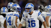 Sep 22, 2025; Baltimore, Maryland, USA; Detroit Lions quarterback Jared Goff (16) reacts with wide receiver Amon-Ra St. Brown (14) during the first half against the Baltimore Ravens at M&T Bank Stadium. Mandatory Credit: Peter Casey-Imagn Images