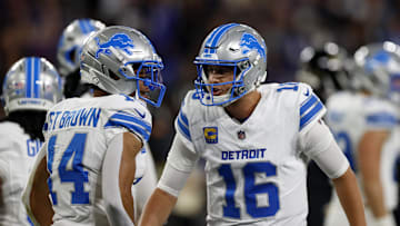 Sep 22, 2025; Baltimore, Maryland, USA; Detroit Lions quarterback Jared Goff (16) reacts with wide receiver Amon-Ra St. Brown (14) during the first half against the Baltimore Ravens at M&T Bank Stadium. Mandatory Credit: Peter Casey-Imagn Images