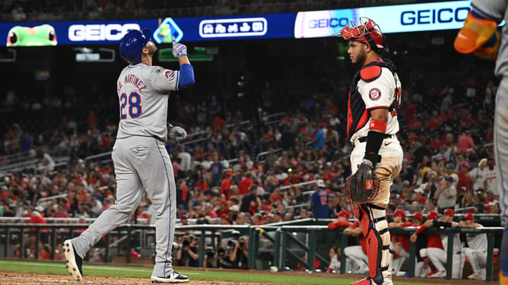 Jul 1, 2024; Washington, District of Columbia, USA; New York Mets designated hitter J.D. Martinez (28) looks to the sky in front of Washington Nationals catcher Keibert Ruiz (20) after hitting a three run home run during the tenth inning at Nationals Park. Mandatory Credit: Rafael Suanes-USA TODAY Sports