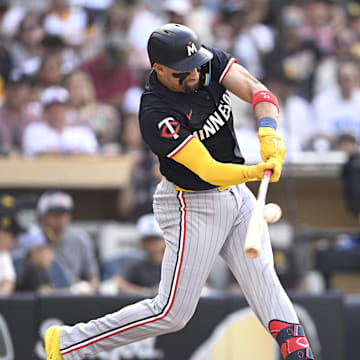 Minnesota Twins designated hitter Royce Lewis (23) hits a sacrifice fly against the San Diego Padres during the third inning at Petco Park in San Diego, Calif., on Aug. 21, 2024.