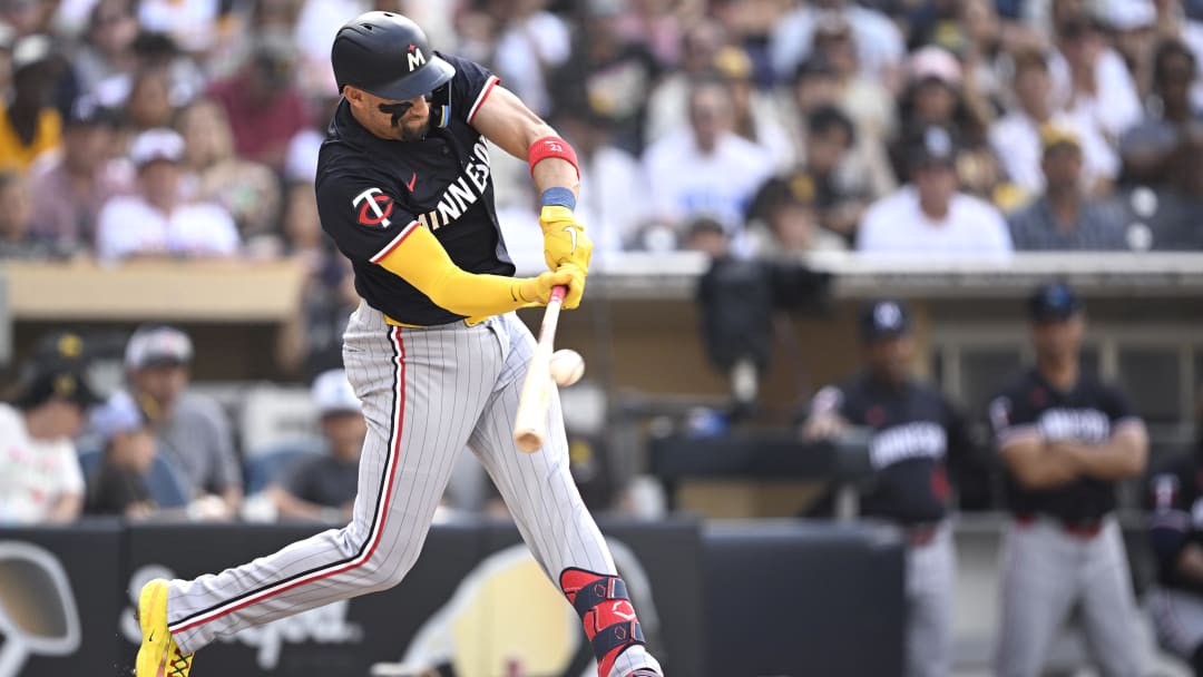 Aug 21, 2024; San Diego, California, USA; Minnesota Twins designated hitter Royce Lewis (23) hits a sacrifice fly against the San Diego Padres during the third inning at Petco Park.